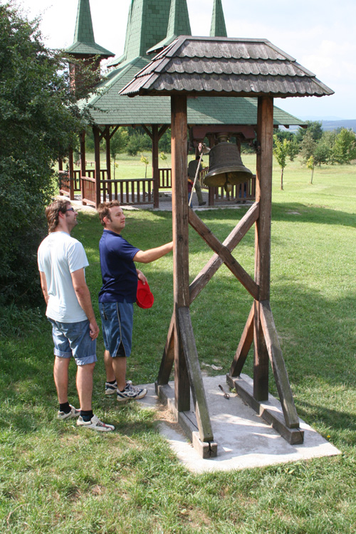 Petr and Roman rinning a bell